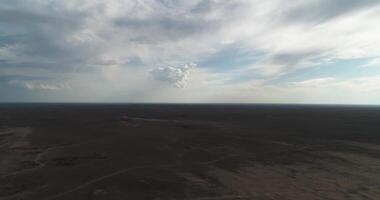 Dronn flies over the sand dunes of the desert on a cloudy day video