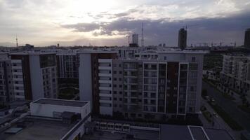 A drone flies over newly built high-rise buildings video