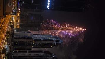 Dubai, UAE - 1 1 2023. Vertical shooting of the Dubai skyscraper during the New Year's fireworks video