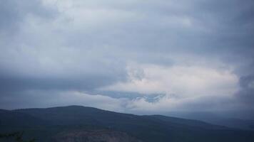 Panorama of mountains on a rainy cloudy day. video