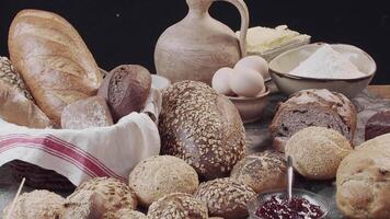 Different types of fresh baked Dutch bread is on the wooden table video