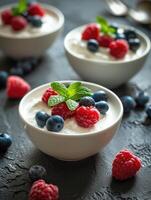 AI generated Curd dessert with cream, raspberries, and blueberries garnished with fresh mint photo