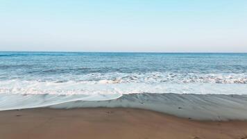 Slider on the coast with ocean waves crashing on the beach video