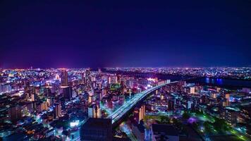 A night timelapse of cityscape near Yodo river in Osaka wide shot video