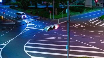 A night timelapse of traffic jam at the city intersection in Tokyo tilt video