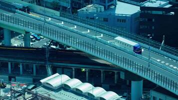 A timelapse of traffic jam near the railway in Osaka telephoto shot panning video