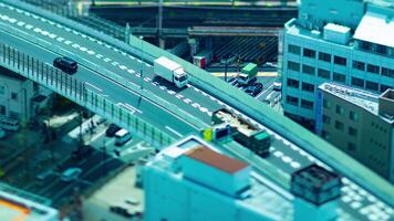 A timelapse of miniature cityscape near the highway in Osaka high angle view zoom video