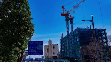 A timelapse of crane at the under construction in Tokyo panning video