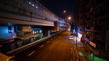 A night timelapse of the traffic jam at the city street under the highway wide shot video