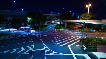 A night timelapse of traffic jam at the city intersection in Tokyo wide shot tilt video