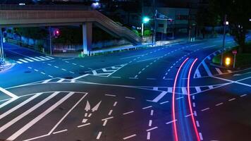 une nuit laps de temps de circulation confiture à le ville intersection dans tokyo video