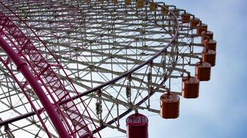 A timelapse of rolling ferris wheel in Yokohama low angle zoom video