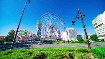 A timelapse of rolling ferris wheel in Yokohama wide shot tilt video