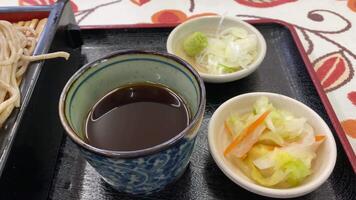 Soba noodle with sliced Japanese leek and wasabi at lunch top shot video