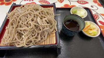 Soba noodle with sliced Japanese leek and wasabi at lunch top shot video