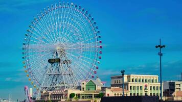 A timelapse of rolling ferris wheel in Yokohama tilt video