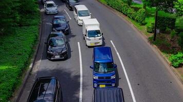 A timelapse of traffic jam at the downtown street in Tokyo telephoto shot panning video