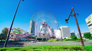 A timelapse of rolling ferris wheel in Yokohama wide shot zoom video
