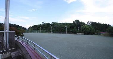 A the closed elementary school ground at the country side wide shot panning video