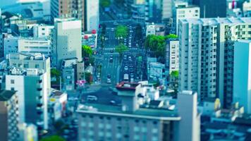 A dusk timelapse of high angle miniature cityscape at the urban street in Osaka tilt video