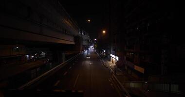 A night traffic jam at the city street under the highway wide shot video