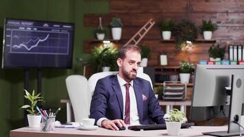 Office worker, alone at work, raises his hands happily in the air. Promotion at the job video