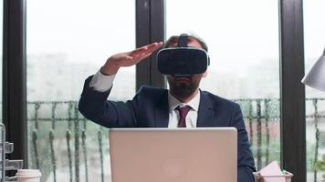 Using virtual reality to study business trends. Modern office with big windows video