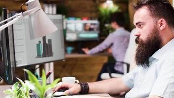 Architect works in 3D software to improve buildings structure. He analyzes a render and the software model video