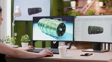 Over the shoulder shot of 3D designer working on new wind turbine prototypes in creative media agency office video