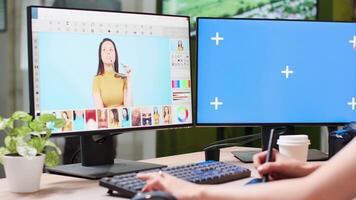 Close up of mock-up screen in creative media agency office. Photographer is working on professional editing software video