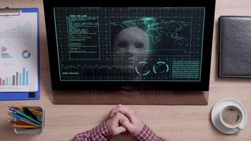 A reflection of a hacker in white mask sits in front of a monitor and analyzes data. Break the grid. Secret intelligence. Classified information. video