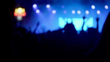 Young fans gathered at a rock concert clapping and having fun. Fans at a music festival with hands up in the air. video