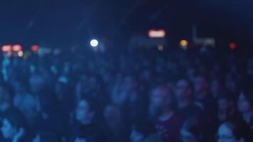 Fans enjoying the performance of their favorite rock band. Audience at a rock concet in front of the stage. video