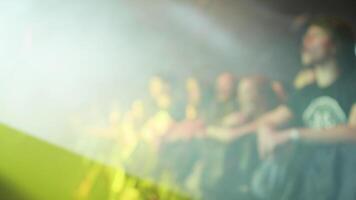 Rock fans in front row dancing and having fun. Young fans at a rock event enjoy themselves in front of the stage. video