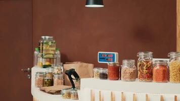 Client bringing organic produce selection at checkout, talking to merchant about sustainable lifestyle and healthy eating. Woman shopping for ethically sourced goods and natural food supplies. video