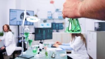 POV shot of assistant hand bringing test samples to the researcher table video