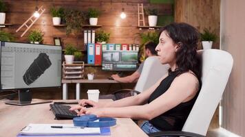 Female CAD designer drinks cofee while working in professinoal 3D software. She develops new wind turbine prototypes video
