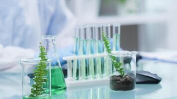 Scientist working in the lab with various tools on the table in modern research facility video