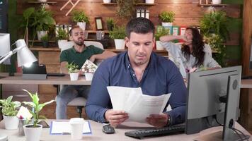 Office workers are celebrating a big sale. They throw papers in the air video