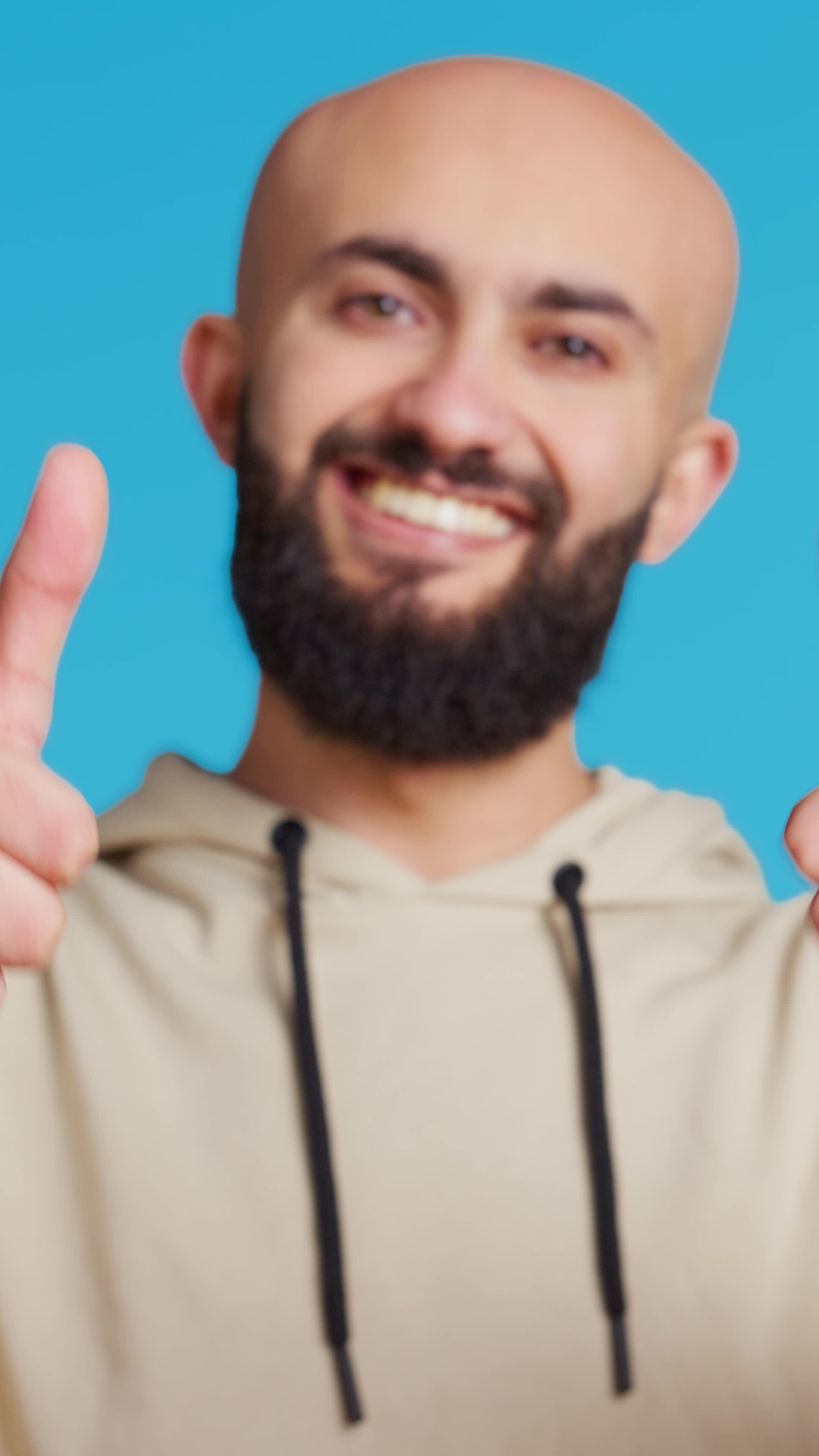 Vertical Video Arabic person does thumbs up symbol in studio