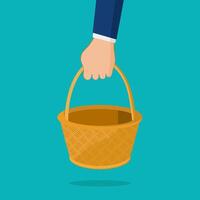 Hand holding an empty wicker basket. Vector