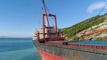 Aerial view of the ship washed ashore. Shot. Top view of an abandoned old and rusty shipwreck on a stormy day video