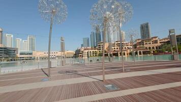 DUBAI - UAE, APRIL 3, 2023. Dubai city architecture under blue sky. Action. High rise buildings in the city center. video