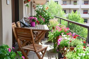 AI generated Beautiful balcony with comfortable chairs, wooden table and many potted flowers plants. Generative AI photo