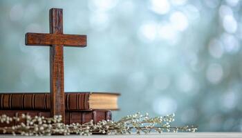 AI generated A table with a wooden cross biblical books and delicate willow twigs against an abstract light background, palm sunday greetings photo