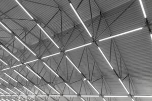 car dealership or repair shop ceiling with beam flooding light photo