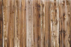 old dry weathered brownish gray wooden planks board surface - full frame background and texture photo