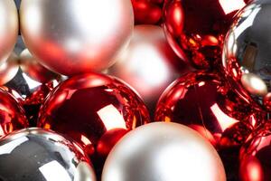 Christmas mirror balls, full frame background of red, silver and white, close-up. photo