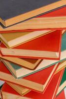 abstract books background - old red and muted green ones in a vertical stack photo