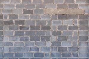 gray concrete brick wall with cancelled window, texture and flat full-frame background photo